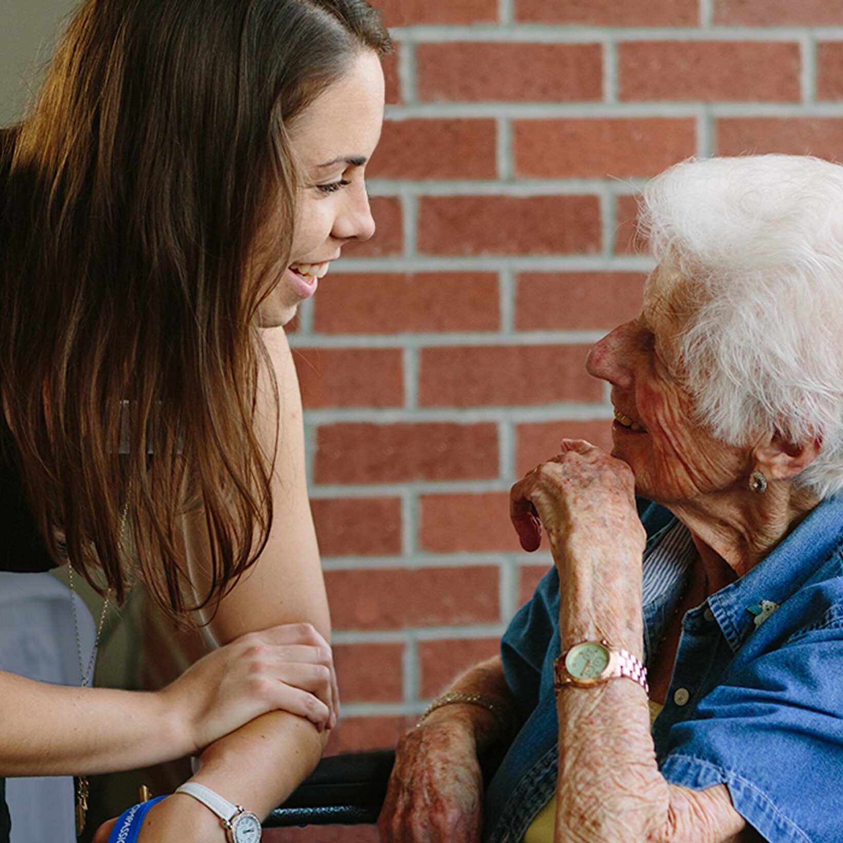 Elim Village staff member chatting with Full Care resident