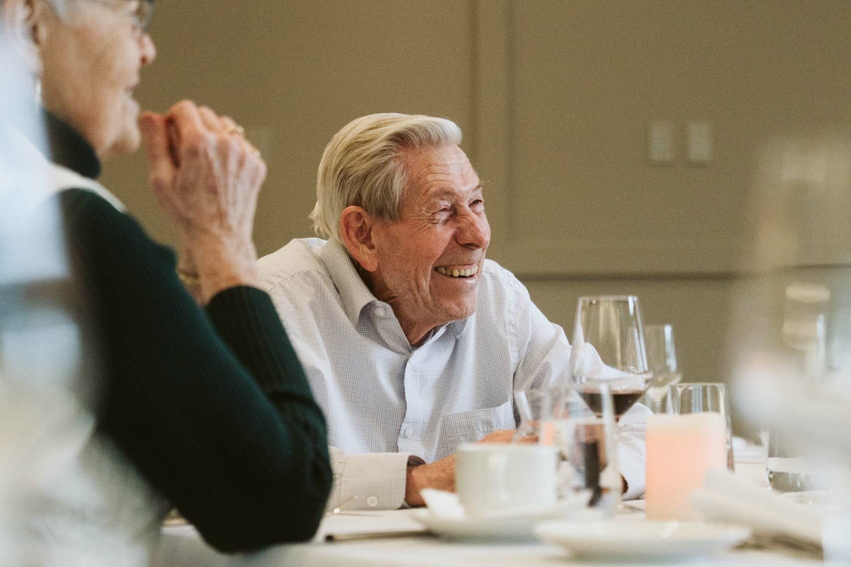 Resident Smiling at Summit Dining, located at Elim Village Garrison Crossing
