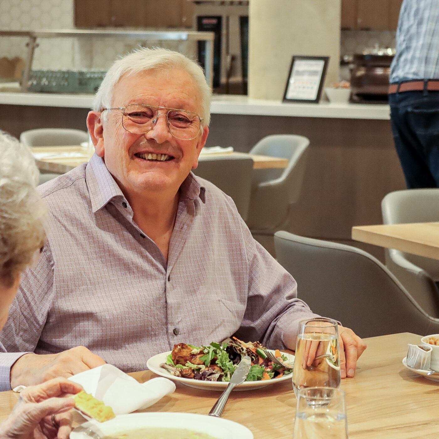 Elim Village Garrison Crossing resident, Andrew, enjoying a meal in The Hawthorn