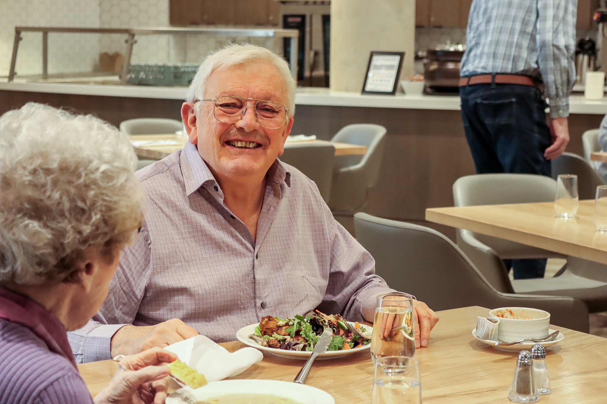 Elim Village Garrison Crossing resident, Andrew, enjoying a meal in The Hawthorn